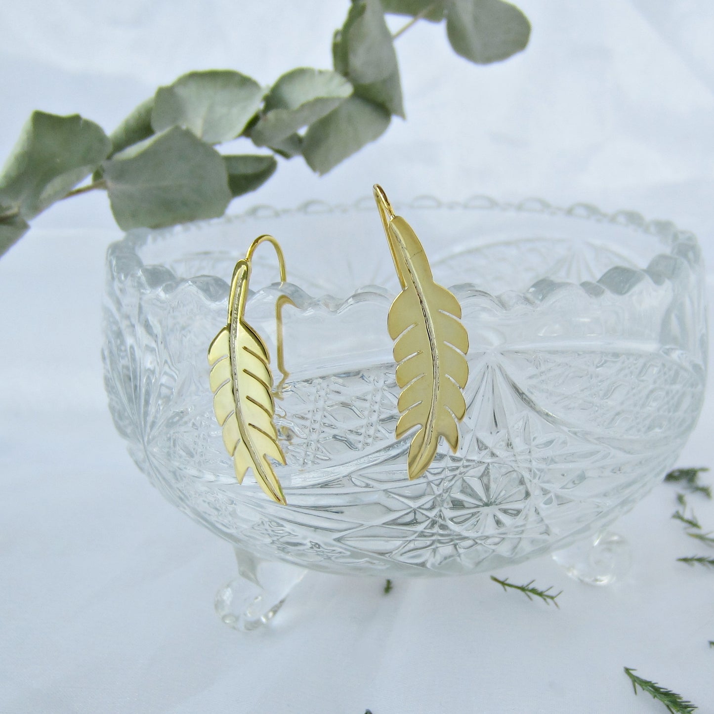 Indian feather golden earrings