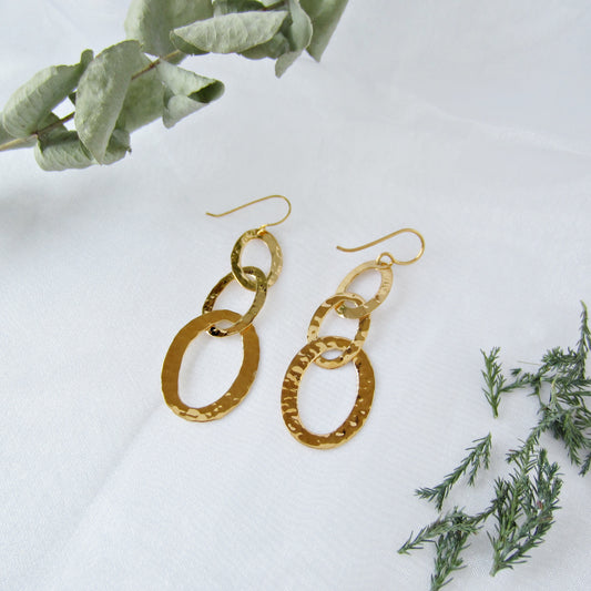 Three oval earrings